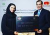 Receiving a MasterCard's donation handed by Raghu Malhotra the President of Middle East and Africa