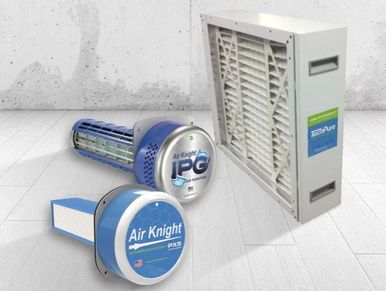 Various air purification devices displayed on a white surface.