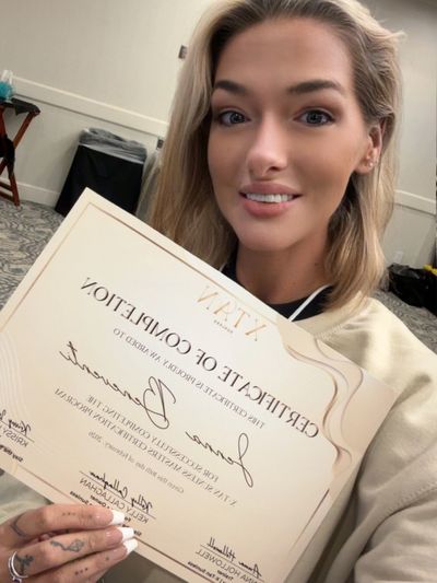 Woman holding certificate