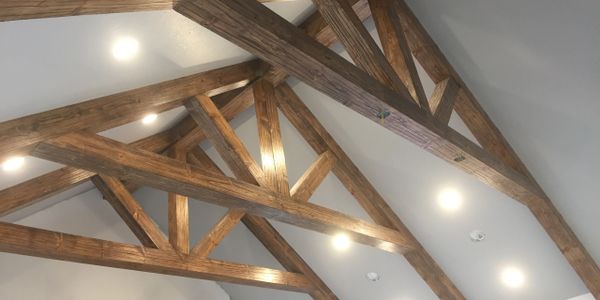 Make a statement with ceiling trusses and beams.