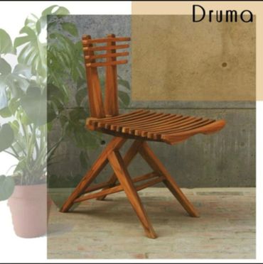 Wooden chair with a slatted design and angled legs.