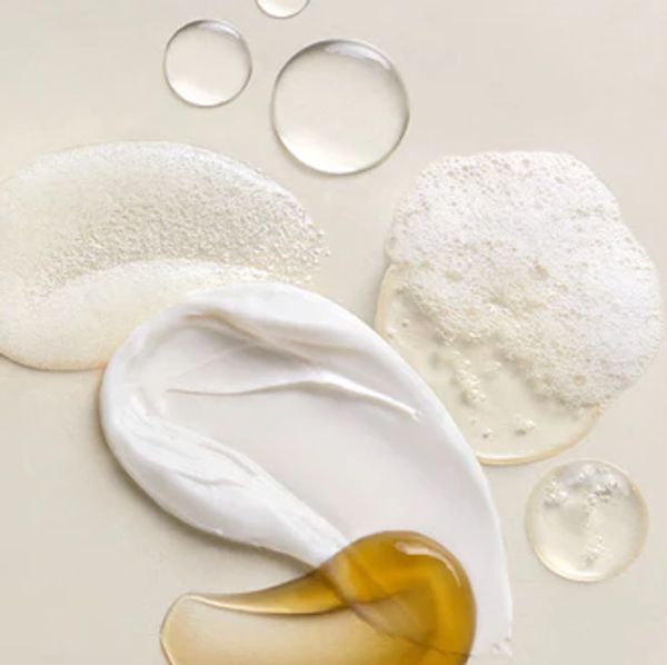 Flat lay of butter cream and oil for moisturizing
