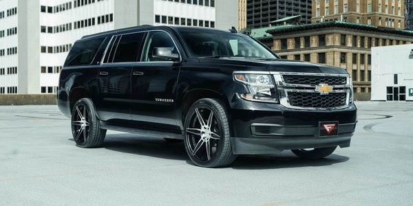 A black Chevrolet suburban 