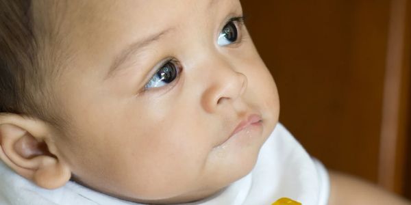 closeup of baby's face looking upward