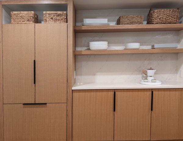 custom white oak cabinetry, quartz backsplash and countertop, panel ready refridgerator