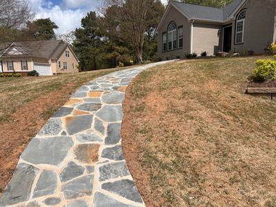 Flagstone walkway installation on a sloped front yard in Jefferson, Georgia — hardscape design - SLS