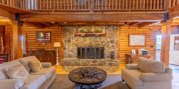 Lounge in front of the wood fireplace in the common area of the Lodge