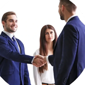 two people shaking hands with other person in middle behind