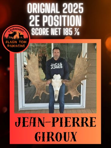 Jean-Pierre Giroux holding large moose antlers, awarded 2nd position in 2025.