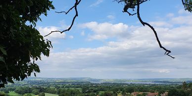 Landscape photograph of a village of Compton Martin the Chew Valley with the lake in the distance