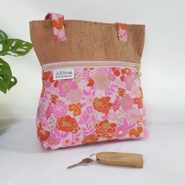Handbag with In Stitches label and a key