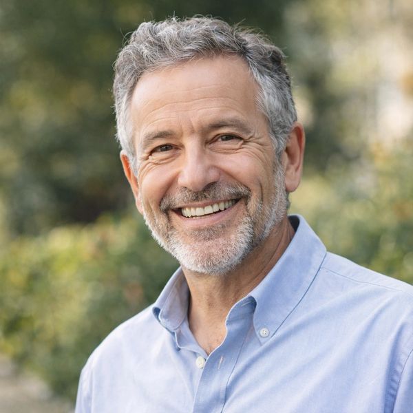 Smiling middle-aged man outdoors.