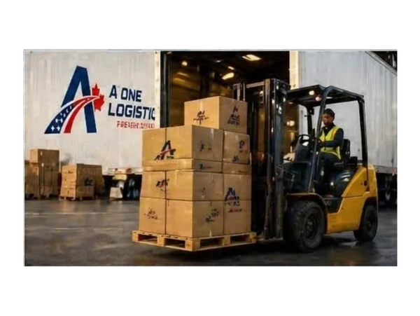 Forklift loading boxes onto a truck at A One Logistic warehouse.