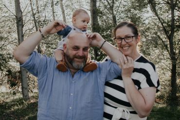 Family enjoying a happy moment outdoors.