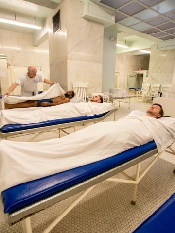 Men's hot towel packs with a bath attendant at the Buckstaff Bathhouse in Hot Springs, Arkansas