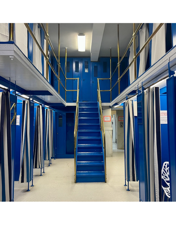 Buckstaff Bathhouse blue and brass two-story men's locker room on first floor