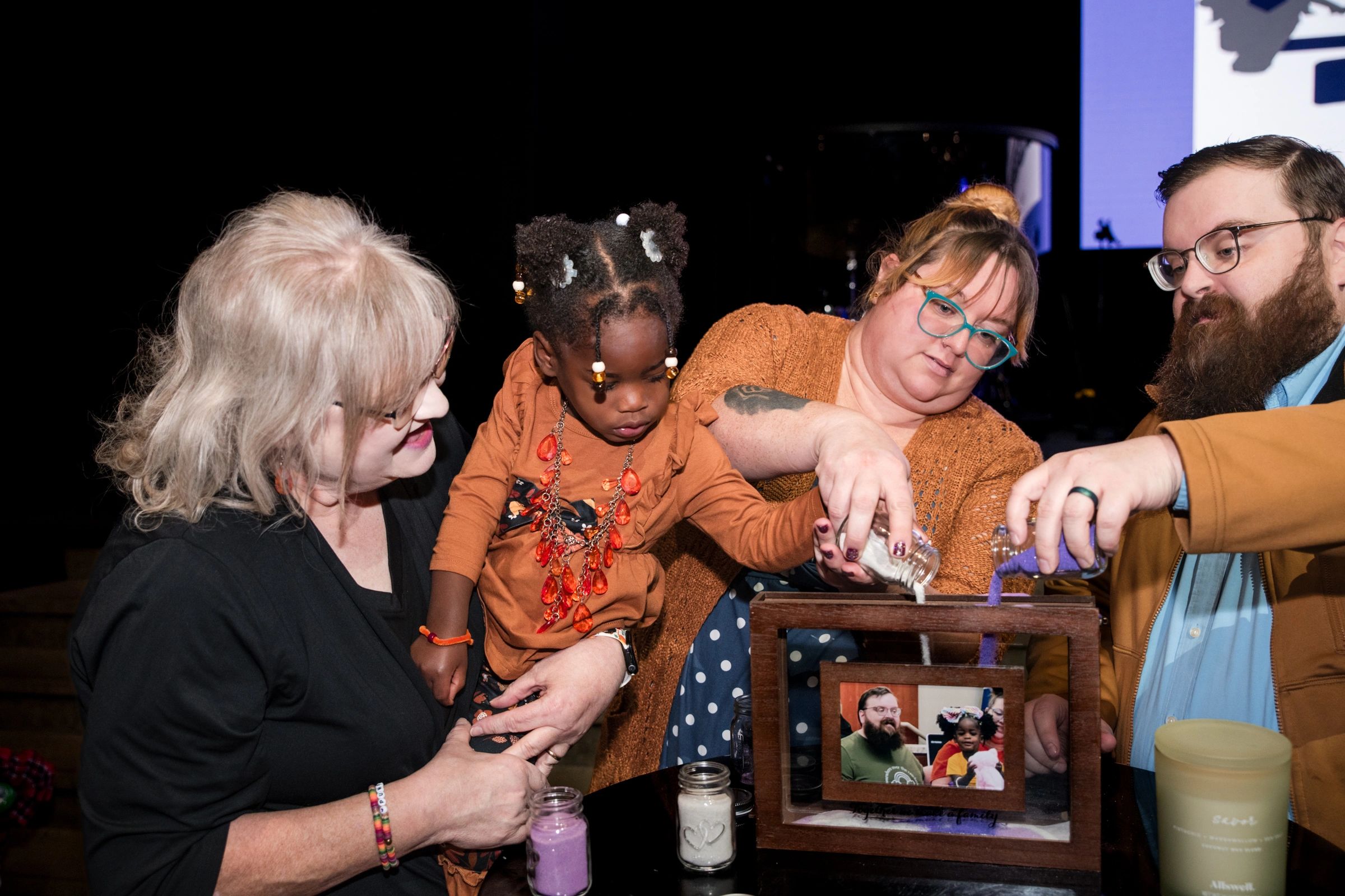 Cherished Impressions connecting with children and families at a community event