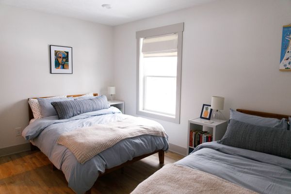 Bedroom with Two Queen Beds. Remodel and Renovations and New Home Construction.