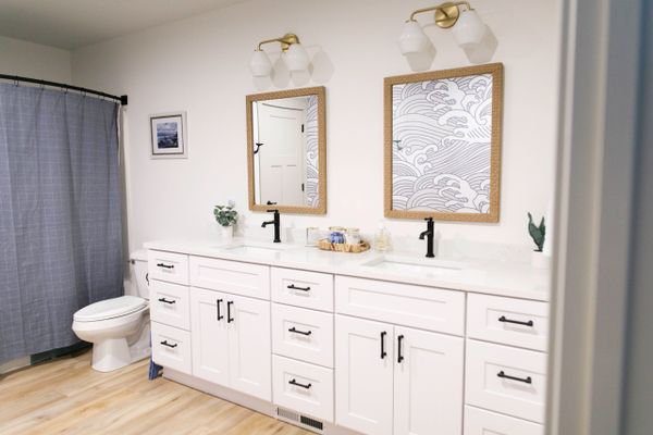 Bathroom with Double Vanity and Modern Wallpaper. Remodel and Renovations and New Home Build.