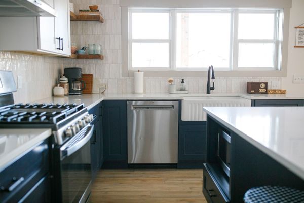 Kitchen with Blue and White Cabinets and Quartz Countertops. Remodel and Renovations and New Homes.