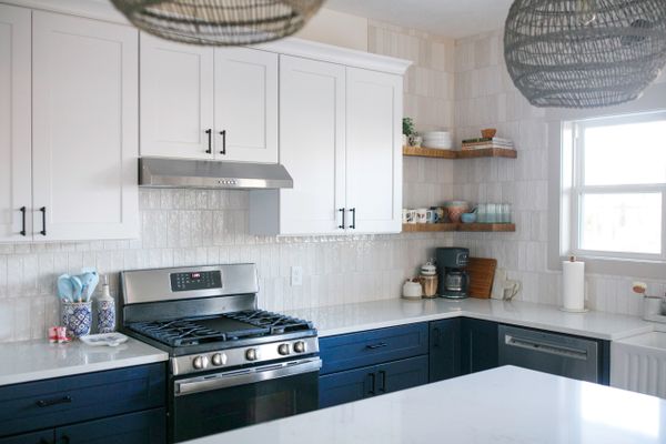 Kitchen with Blue and White Cabinets and Quartz Countertops. Remodel and Renovations and New Homes