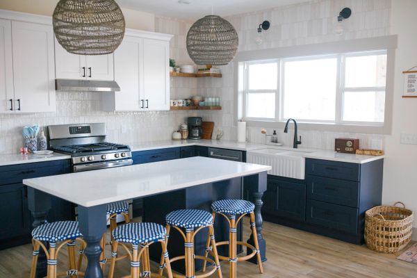Kitchen with Blue and White Cabinets and Quartz Countertops. Remodel and Renovations and New Homes