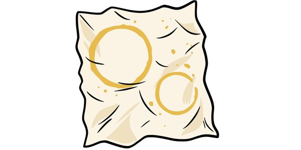 Two golden rings on a crumpled paper.