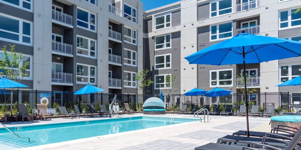 A stunning view of Union & West Apartments in Walpole, showcasing the modern architectural design.