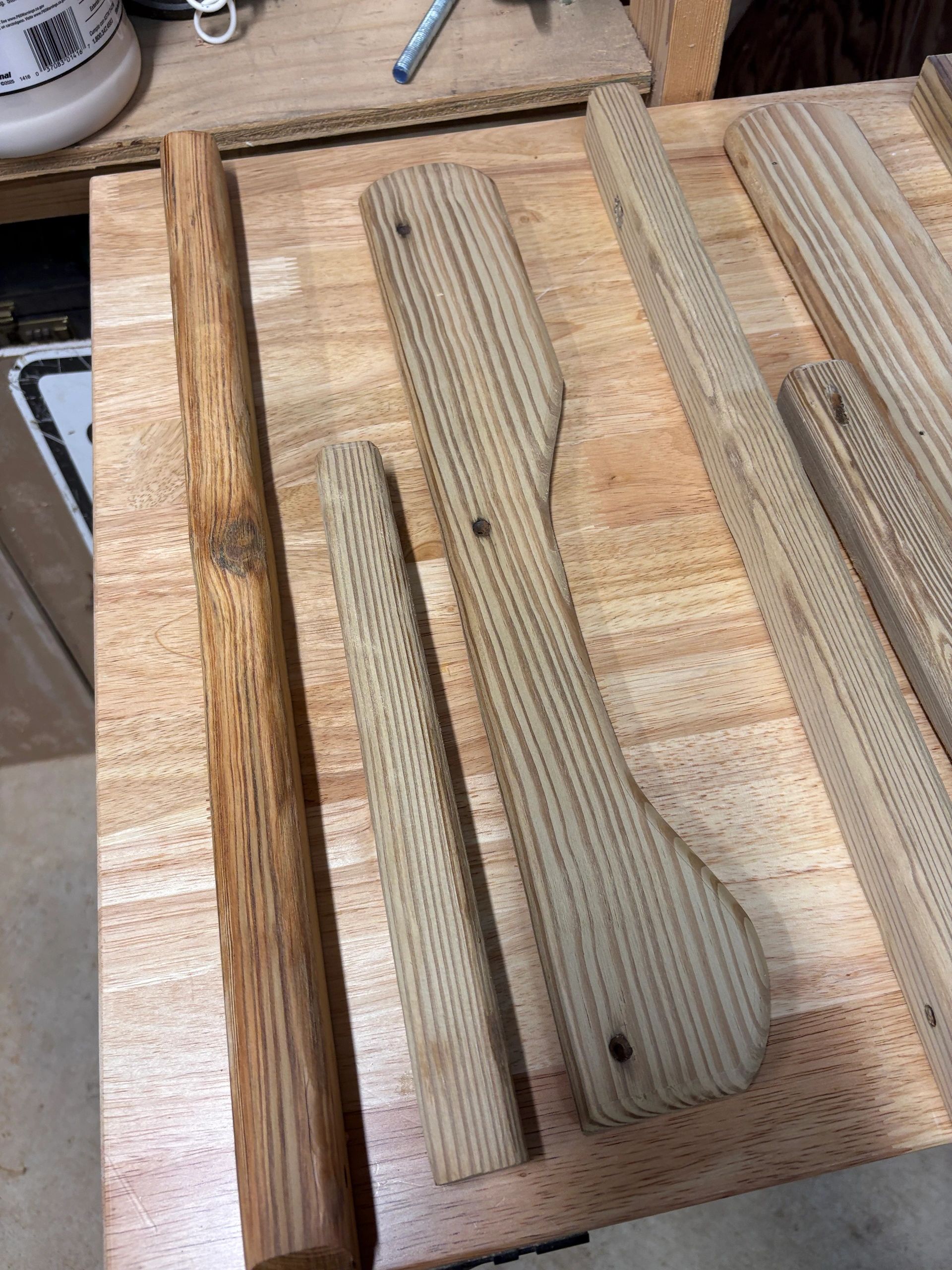 Various wooden dowels and pieces on a wooden table.
