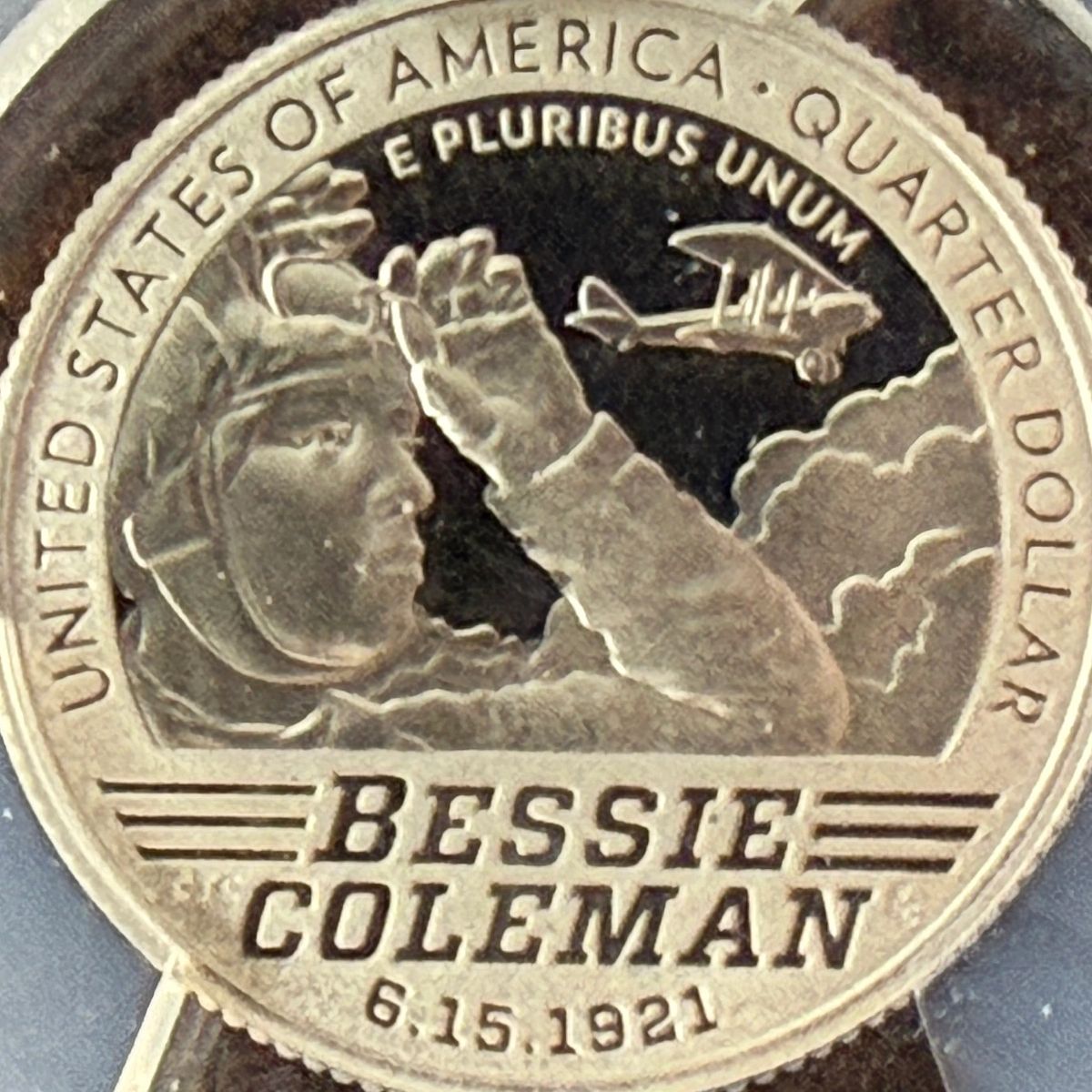 Close-up of a Bessie Coleman commemorative quarter coin.