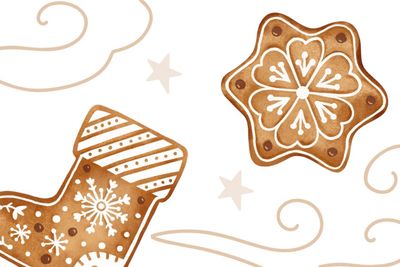 Decorative gingerbread cookies with white icing on a white background.