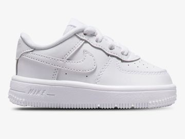 White Nike Air Force 1 sneaker for kids with classic design.