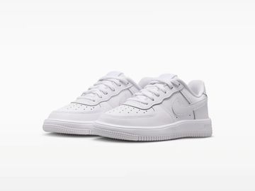 Pair of classic white Nike Air Force 1 sneakers with clean design.