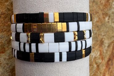 Black, White & 24K gold--This 5-stack collection enhances the simplest black outfit.