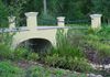 Bridge over man made stream water feature.