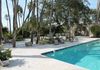 Travertine pool deck transitioning into a crushed shell hangout.