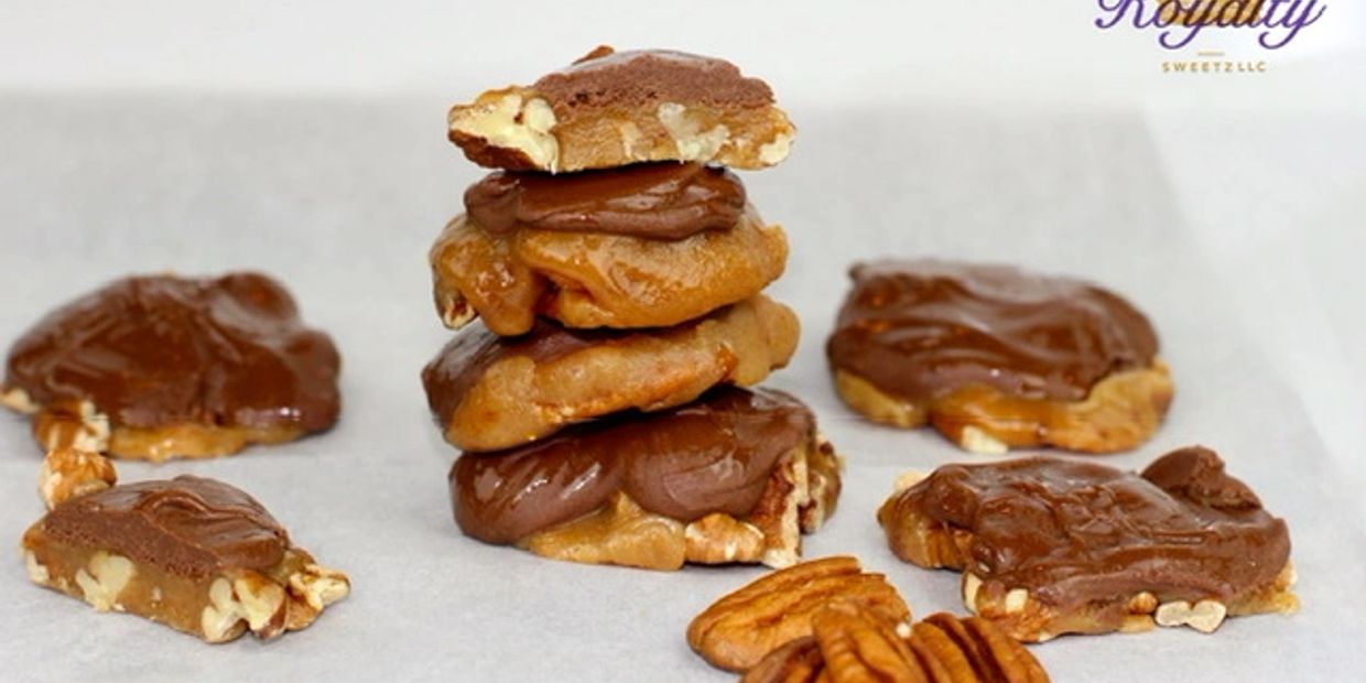 Chocolate-covered pecan candies arranged on parchment paper.