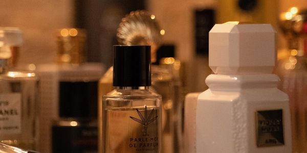 Bottle of niche perfumes on the table, simulating perfume store counter