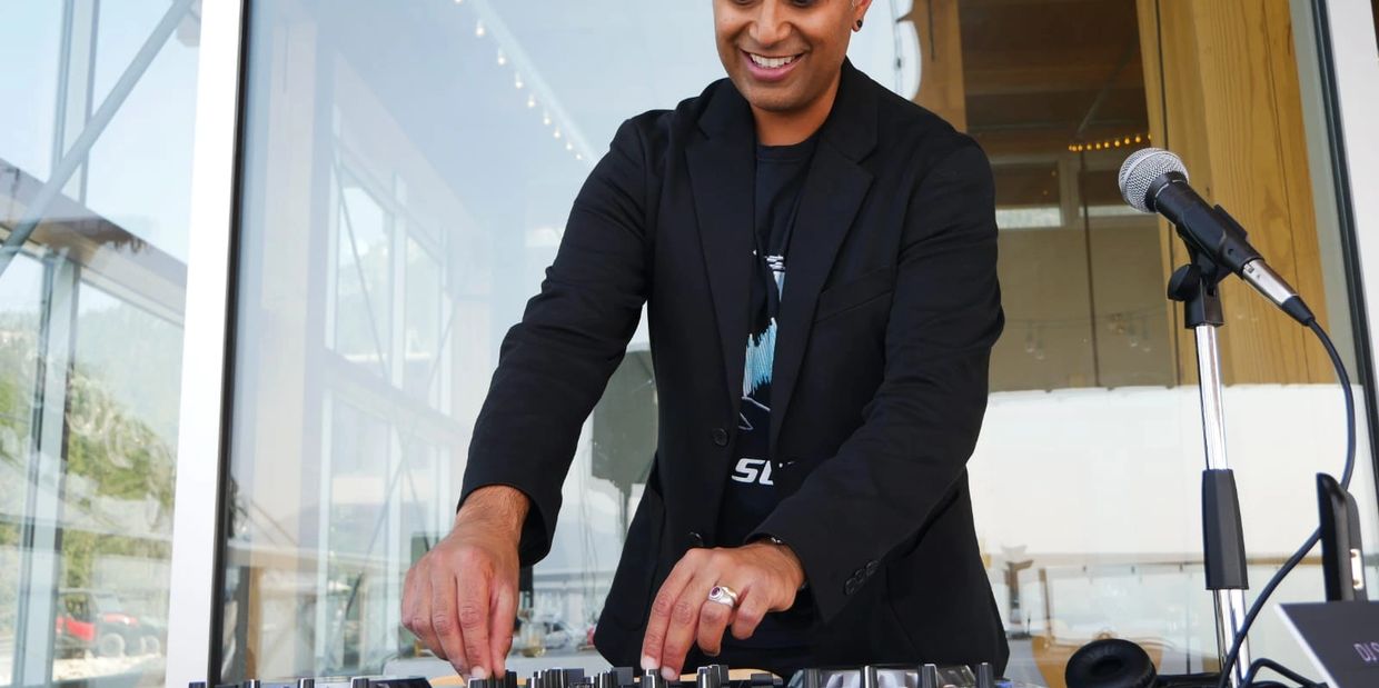 vancouver dj smiling when playing music