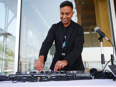 smiling vancouver dj performing music
