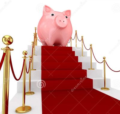 Piggy bank on a red carpeted staircase.