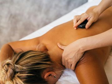 Hot stone therapy at Wild Roots Massage Therapy by Angela Hope, RMT in Calgary. Deep relaxation. 