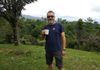 Ralf enjoying his morning ritual- coffee in the rainforest