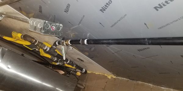 alt="Licensed plumber inspecting gas line for leaks and safety in Decatur TX"
