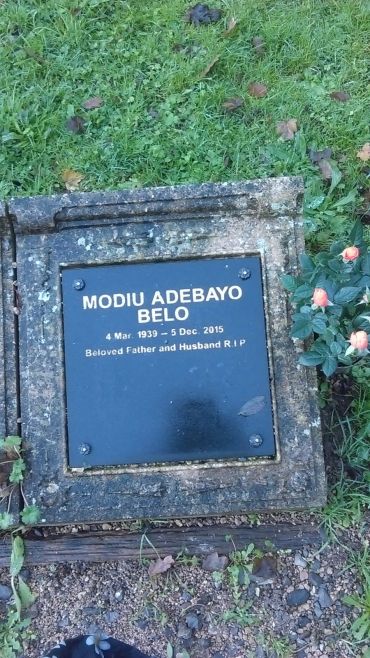 Gravestone for Modiu Adebayo Belo, 1939-2015, beloved father and husband.