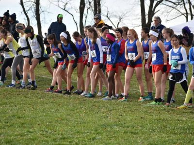 Girls lined up for a cross-country race start.