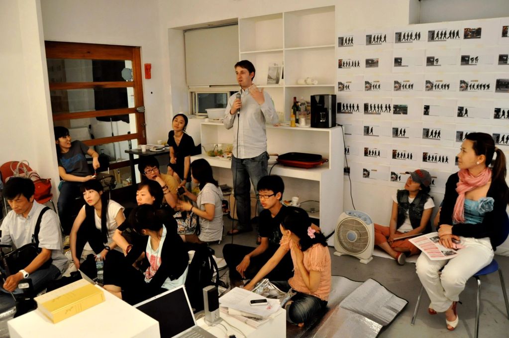 Group meeting with a speaker indoors.