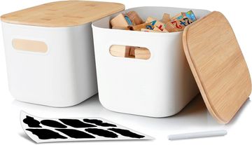 Two white storage boxes with wooden lids, one open and filled with wooden blocks.