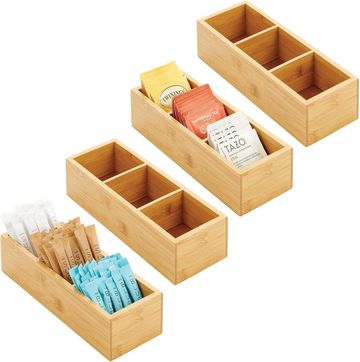 Four bamboo organizers for tea bags and packets.