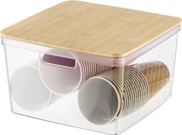Clear storage box with a wooden lid holding paper cups.